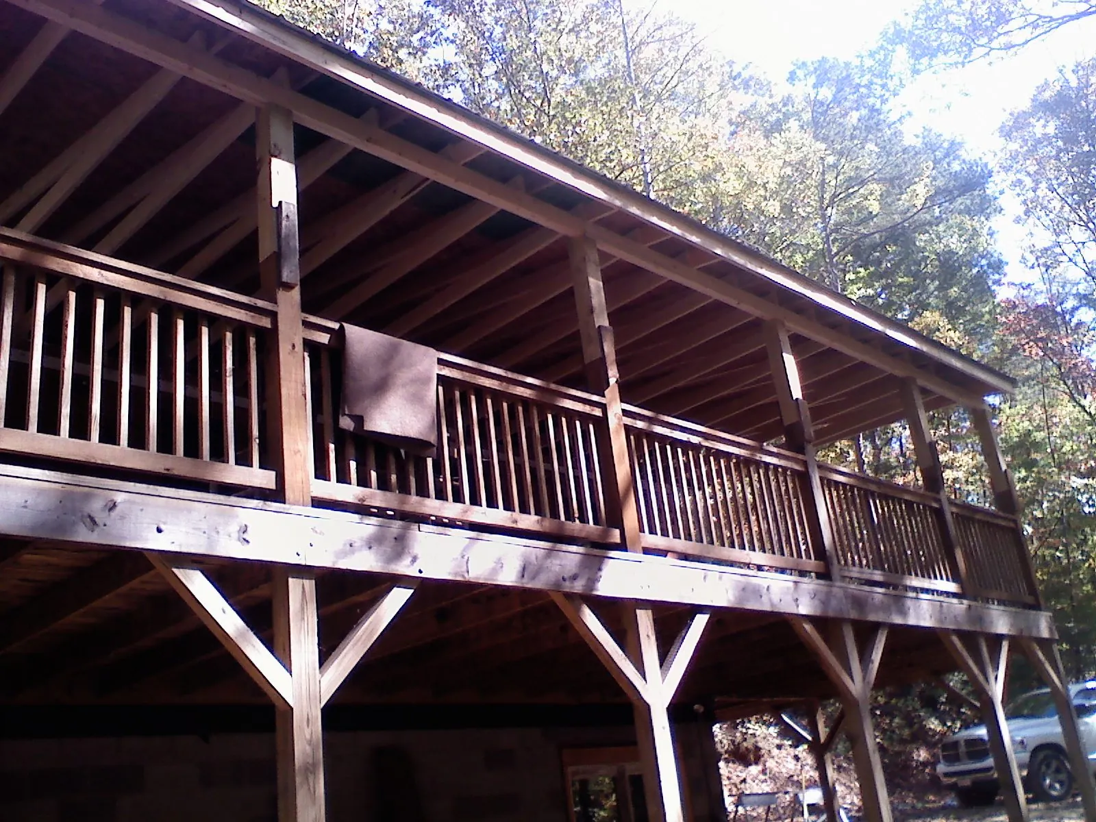 Timber framing under a new elevated porch and deck in Sodus